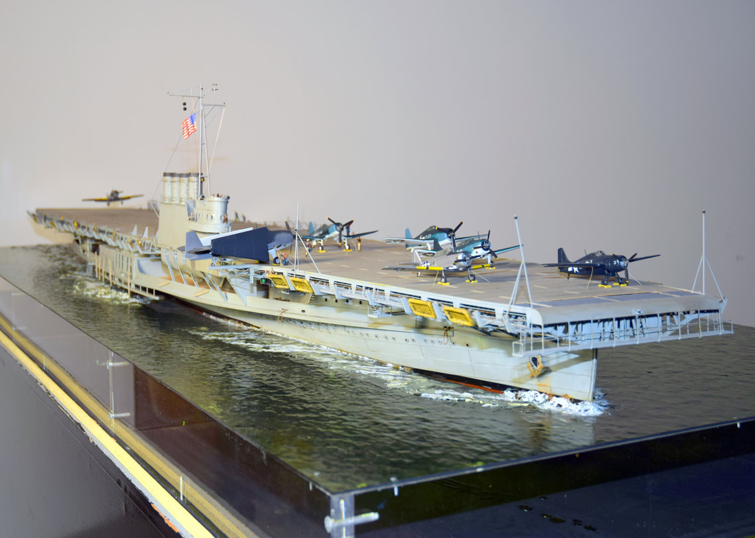 Model of the USS Wolverine, mounted on acrylic fake water.